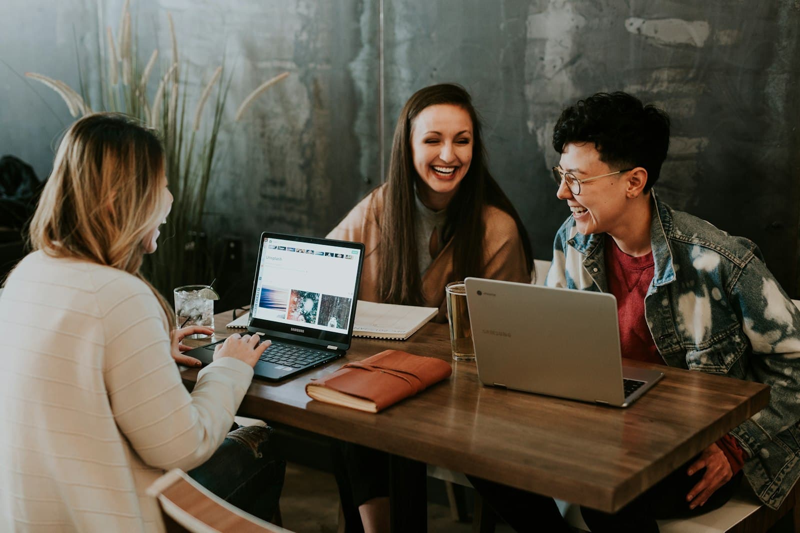 Team reviewing creator shortlists together over laptops