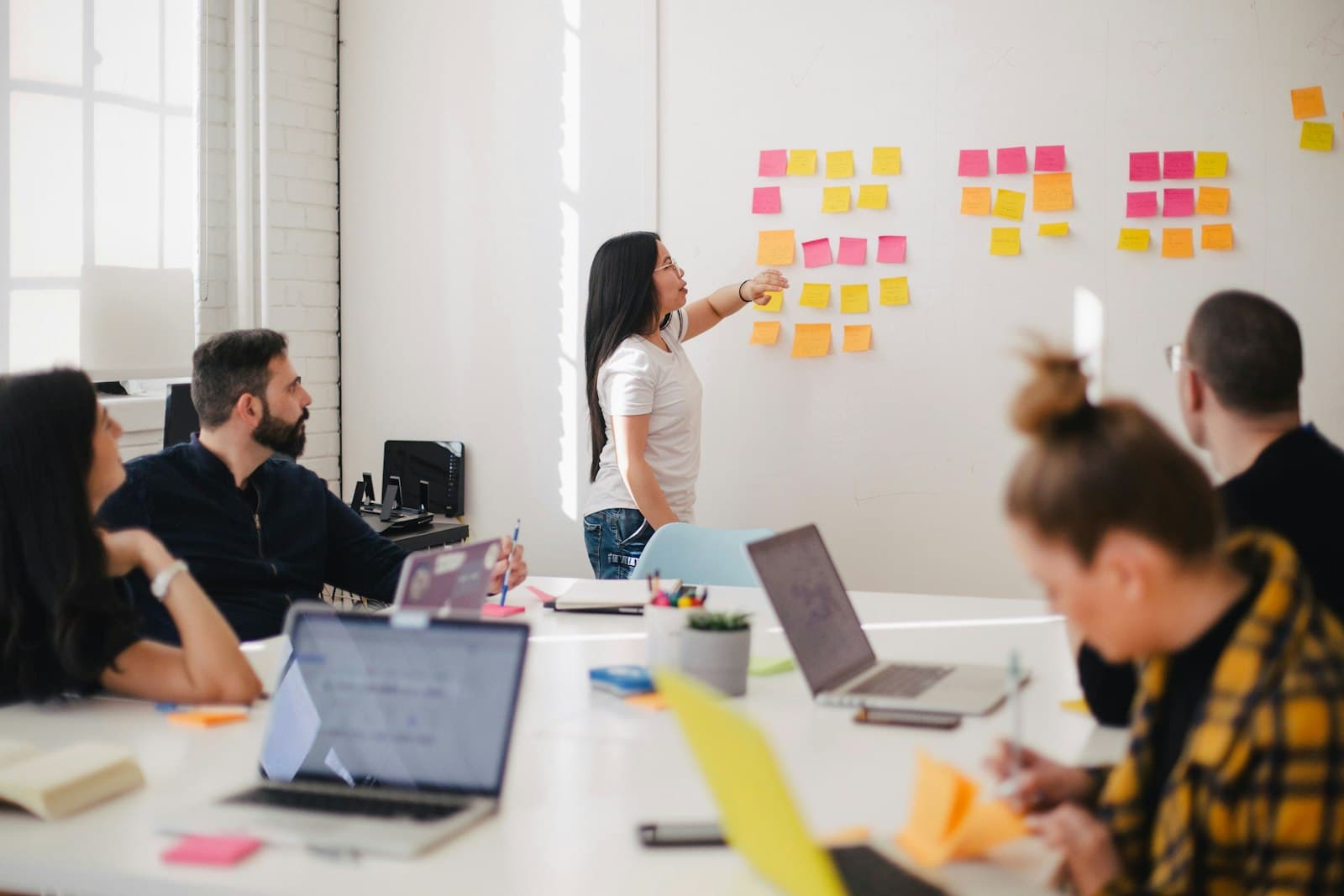 Strategist mapping a campaign plan with sticky notes